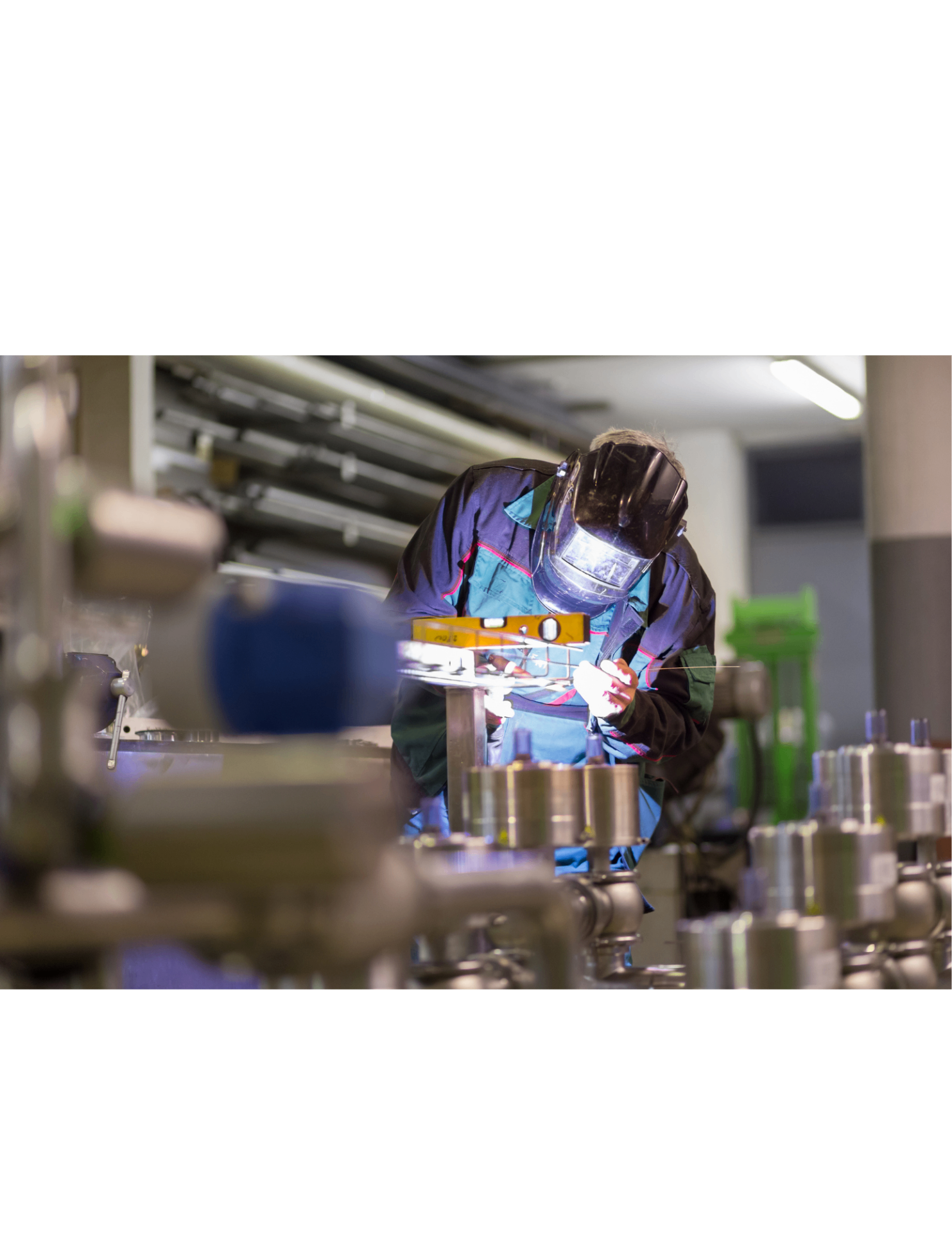 Industrial tradespeople working safely in a modern industrial facility